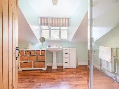 a bathroom with a sink and a window at Bodywen in Llangynog