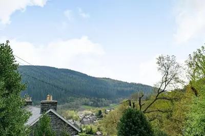 a view of a valley with a mountain at 2 Isygraig in Corris