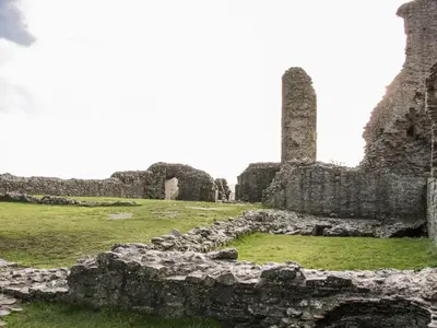 an old castle with ruins in a field at Bryn Caer in Chirbury