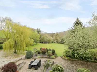 an aerial view of a garden with benches and trees at The Mill House in Carrog