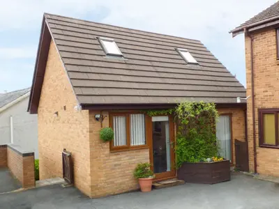 a brick house with a brown roof at Penylodge in Builth Wells