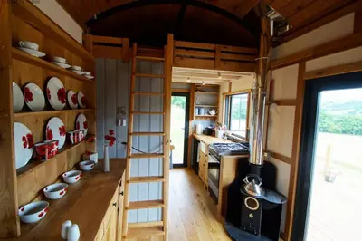 a kitchen with a stove and plates on the wall at Flying Scotsman in Cray