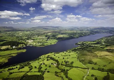 an aerial view of a lake in the countryside at Bwthyn Bryn yr Aber in Bala