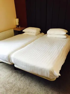 two beds sitting next to each other in a room at The Vaults in Shrewsbury