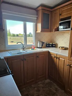 a kitchen with a sink and a window at Ruth's Repose Country Retreat with private hot tub & Stunning Views in Shrewsbury