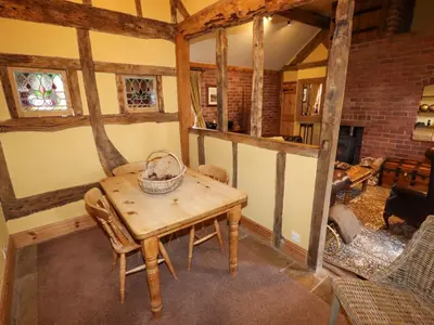 a room with a table and chairs in a room at The Old Dairy in Shrewsbury