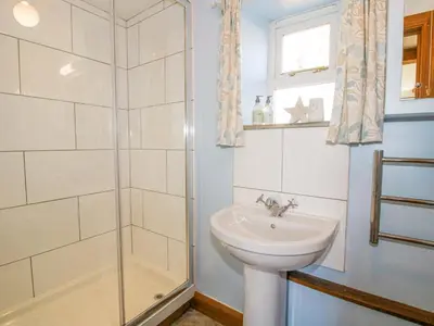 a bathroom with a sink and a shower at The Old Workshop in Church Pulverbatch