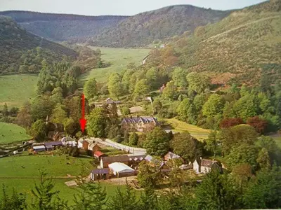 an aerial view of a village in a valley at Tailor's Cottage in Abbey-Cwmhir