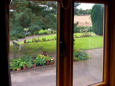 a view of a garden from a window at The Old Cider Mill in Farden