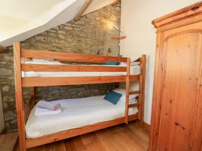 a couple of bunk beds in a room at Mill Cottage in Ciliau-Aeron