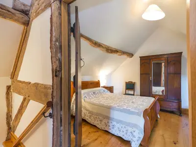 a bedroom with a bed in a attic at Stone House in Ludlow