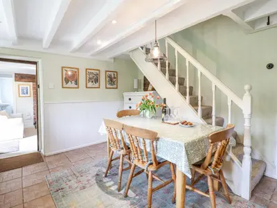 a dining room with a table and chairs at Haulfryn in Llangynog