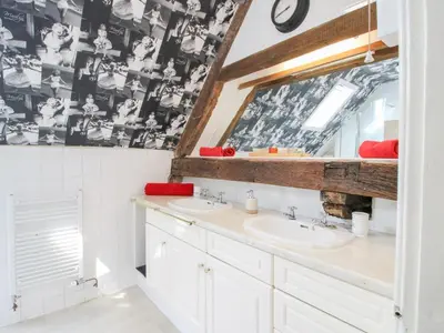 a bathroom with two sinks and a mirror at The Laurels in Bishops Castle