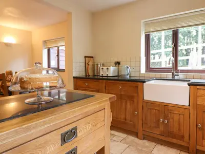 a kitchen with a sink and a counter top at Ty Newydd in Pont Dolanog