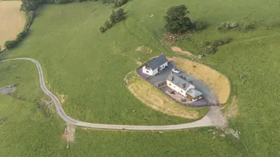 an aerial view of a house in a field at Tyn Llwyn in Llangollen