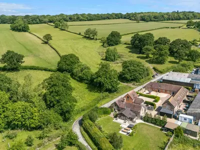 an aerial view of a house in a field at The Old Farmhouse in Craven Arms