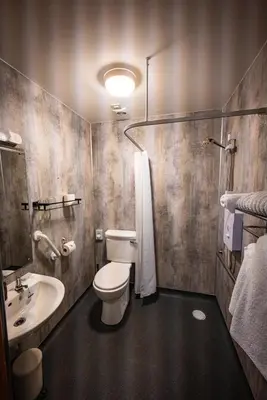a bathroom with a toilet and a sink at Wye Cottage in Builth Wells