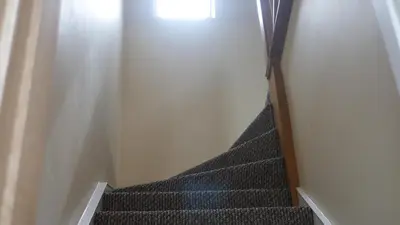 a staircase in a room with a stair case at The Keep in Ludlow