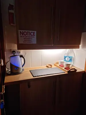 a kitchen counter top with a coffee maker and a kettle at Castle Lodge - Brecon Beacons Accommodation in Sennybridge