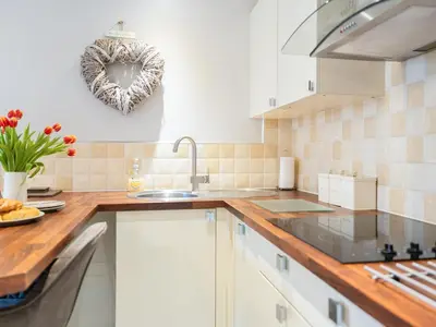 a kitchen with a sink and a counter top at Bwthyn Bach in Dyffryn