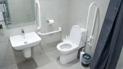 a bathroom with a white toilet and a sink at Penrhos Park in Aberystwyth