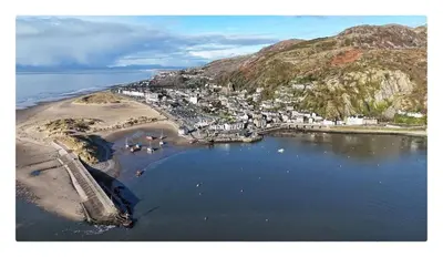 an aerial view of a town next to a beach at The Moorings in Fairbourne