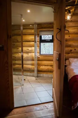 a room with a bed and a window at Coed y Marchog Woodland Retreat in Hereford