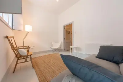 a living room with a couch and a chair at Lion & Pheasant Hotel in Shrewsbury