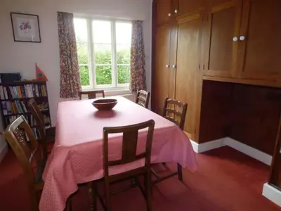 a dining room with a table with a bowl on it at Fiddlers Green in Bucknell