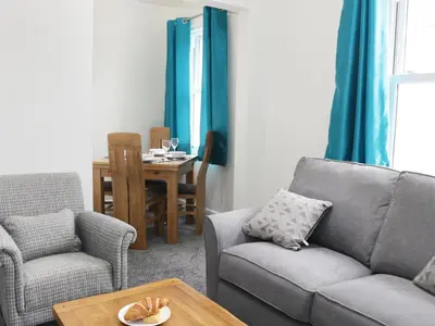 a living room with a couch and a table at 7 Monkmoor Road in Shrewsbury