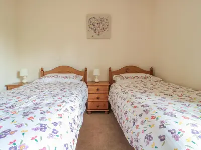 two beds sitting next to each other in a bedroom at Blaen Henllan in Aberedw