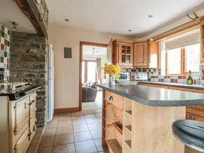 a kitchen with a large counter top in a room at Blaen Henllan in Aberedw