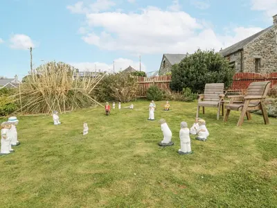 a group of children playing in a yard at Happy Landing in Harlech