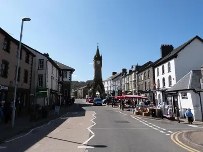 a city street with a clock tower in the distance at 2 Bed in Machynlleth oc-bow39 in Darowen