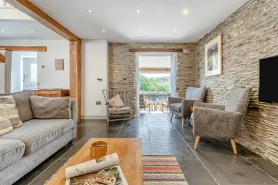 a living room with a couch and chairs and a tv at 3 Bed in Machynlleth oc-bow40 in Darowen
