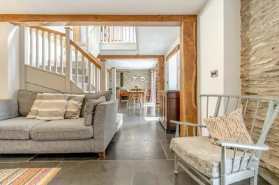 a living room with a couch and two chairs at 3 Bed in Machynlleth oc-bow40 in Darowen