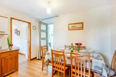 a dining room with a table and chairs at 3 Bed in Bala oc-waf247 in Bettws Gwerfil Goch