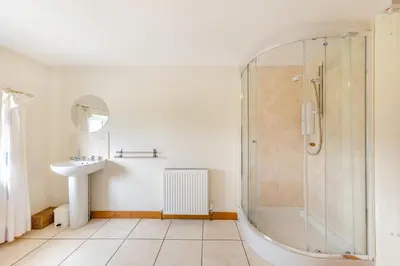 a bathroom with a shower and a sink at 3 Bed in Bala oc-waf247 in Bettws Gwerfil Goch
