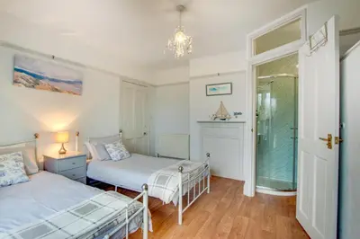 a bedroom with two beds and a window at 6 Bed in Dolgellau oc-wah675 in Arthog