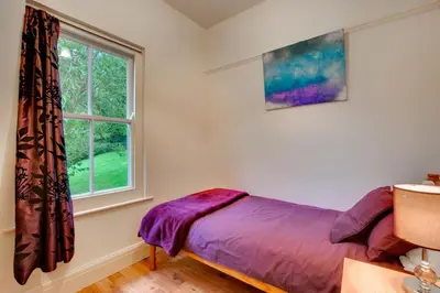 a bedroom with a bed and a window at 6 Bed in Dolgellau oc-wah675 in Arthog