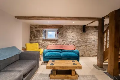 a living room with a couch and a table at 3 Bed in Llangadfan oc-wae284 in Llangadfan