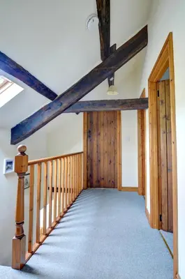 a hallway in a house with wooden beams at 3 Bed in Dolgellau oc-wah605 in Rhydymain