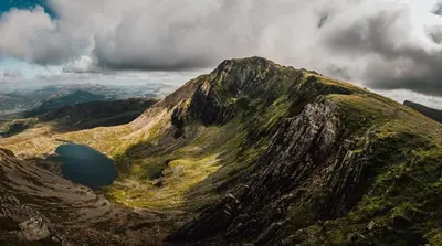 a mountain with a lake on the side of it at 3 Bed in Dolgellau oc-wah605 in Rhydymain