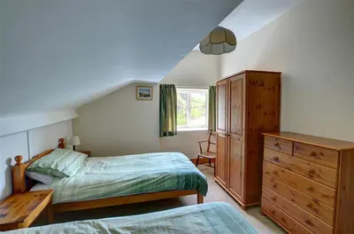 a bedroom with two beds and a dresser at 4 Bed in Presteigne oc-wak235 in Norton