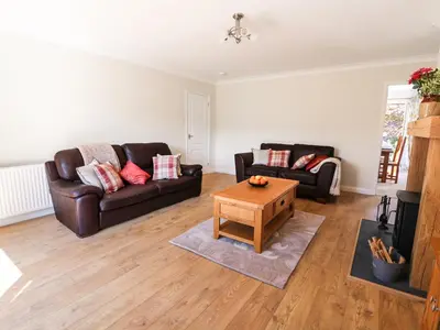 a living room with two couches and a coffee table at Pen Y Maes in Builth Wells