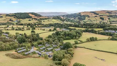 an aerial view of a farm in the hills at Glanyrafon in Rhayader