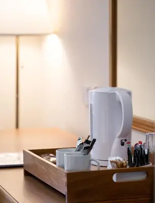 a kitchen counter with a box with a coffee maker at Llety Ceiro Guesthouse in Aberystwyth