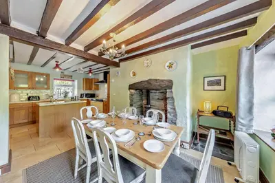 a kitchen and dining room with a table and chairs at 3 Bed in Machynlleth oc-bow43 in Corris