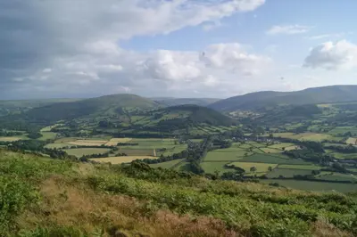 a view of a valley from a mountain at The Granary in Talgarth