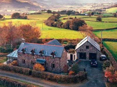 an aerial view of a house in the countryside at Green Lane Cottage in Newtown